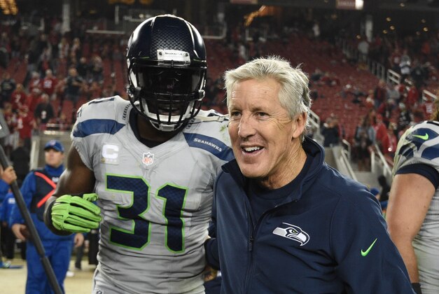 November 27, 2014; Santa Clara, CA, USA; Seattle Seahawks strong safety Kam Chancellor (31) celebrates with head coach Pete Carroll (right) after the game against the San Francisco 49ers at Levi's Stadium. The Seahawks defeated the 49ers 19-3. Mandatory Credit: Kyle Terada-USA TODAY Sports
