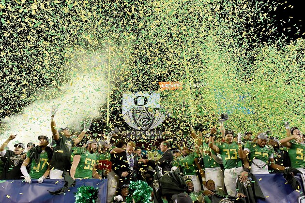 SANTA CLARA, CA - DECEMBER 05:  Oregon Ducks players celebrates winning the Pac-12 Championship game over the Arizona Wildcats at Levi's Stadium on December 5, 2014 in Santa Clara, California. The Ducks defeated the Wildcats 51-13.  (Photo by Thearon W. Henderson/Getty Images)