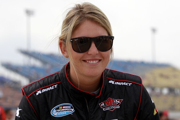 NEWTON, IA - AUGUST 3:  Johanna Long, driver of the #70 ForeTravel Chevrolet,  stands on the grid during qualifying for the NASCAR Nationwide Series U.S. Cellular 250 Presented by Enlist Weed Control System at Iowa Speedway on August 3, 2013 in Newton, Iowa. (Photo by Sean Gardner/Getty Images)