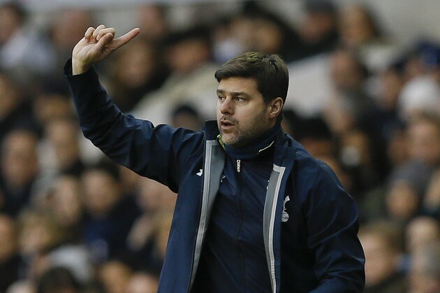 Tottenham's manager Mauricio Pochettino directs his team during the English Premier League soccer match between Tottenham Hotspur and Crystal Palace at White Hart Lane stadium in London, Saturday, Dec. 6, 2014. (AP Photo/Kirsty Wigglesworth)