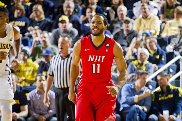 N.J.I.T. guard Winfield Willis (11) reacts after making a basket in the second half of an NCAA college basketball game against Michigan at Crisler Center in Ann Arbor, Mich., Saturday, Dec. 6, 2014. N.J.I.T. won 72-70. (AP Photo/Tony Ding)