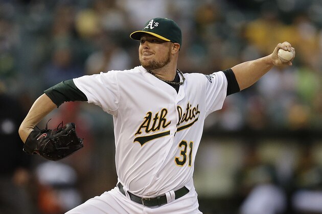 FILE-  In a Sept.. 19, 2014, file photo Oakland Athletics' Jon Lester works against the Philadelphia Phillies in the first inning of a baseball game  in Oakland, Calif.  A person with knowledge of the arrangements says free agent left-hander Jon Lester has plans to meet with the San Francisco Giants the first week of December, 2014.(AP Photo/Ben Margot, file)