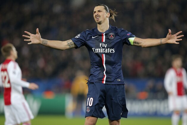 PSG's Zlatan Ibrahimovic celebrates after scoring during the Champions League Group F soccer match between Paris Saint Germain and Ajax at the Parc des Princes stadium in Paris, France, Tuesday, Nov. 25, 2014. (AP Photo/Christophe Ena)