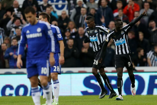 Newcastle United's Papiss Cisse, right, celebrates his goal during their English Premier League soccer match against Chelsea at St James' Park, Newcastle, England, Saturday, Dec. 6, 2014. (AP Photo/Scott Heppell)