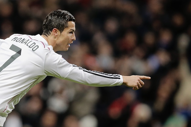 Real Madrid’s Cristiano Ronaldo celebrates after scoring his third goal during a Spanish La Liga soccer match between Real Madrid and Celta de Vigo at the Bernabeu stadium in Madrid, Spain, Saturday, Dec. 6, 2014 . (AP Photo/Daniel Ochoa de Olza)