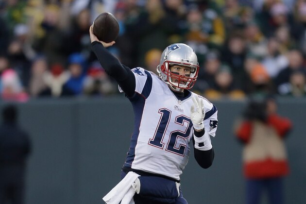 GREEN BAY, WI - NOVEMBER 30:  Quarterback Tom Brady #12 of the New England Patriots passes the football in the second quarter against the Green Bay Packers during the NFL game at Lambeau Field on November 30, 2014 in Green Bay, Wisconsin.  (Photo by Mike McGinnis/Getty Images)