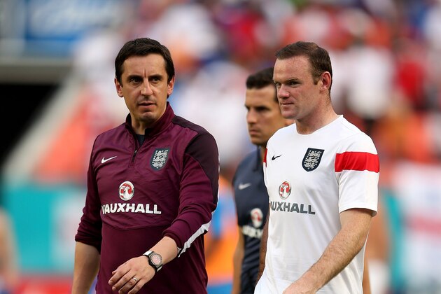 MIAMI GARDENS, FL - JUNE 07:  Wayne Rooney and assistant coach Gary Neville of England walk off at the end of the International Friendly match between England and Honduras at the Sun Life Stadium on June 7, 2014 in Miami Gardens, Florida.  (Photo by Richard Heathcote/Getty Images)