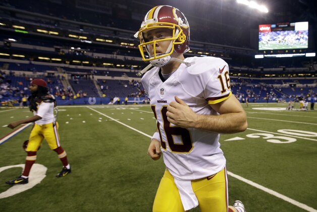 Washington Redskins quarterback Colt McCoy runs off the field following an NFL football game against the Indianapolis Colts, Sunday, Nov. 30, 2014, in Indianapolis. The Colts defeated the Redskins 49-27. (AP Photo/Darron Cummings)