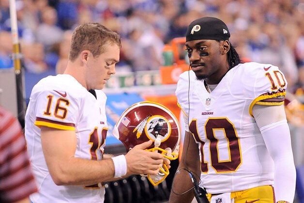 Nov 30, 2014; Indianapolis, IN, USA; Washington starting quarterback Colt McCoy (16) and back-up quarterback Robert Griffin III (10) during second half against the Indianapolis Colts at Lucas Oil Stadium. Mandatory Credit: Thomas J. Russo-USA TODAY Sports