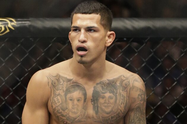 Anthony Pettis runs on the ring before fighting with Donald Cerrone during UFC Lightweight Championship on FOX 6 at the United Center in Chicago, Saturday, Jan. 26, 2013. Pettis won the bout. (AP Photo/Nam Y. Huh)