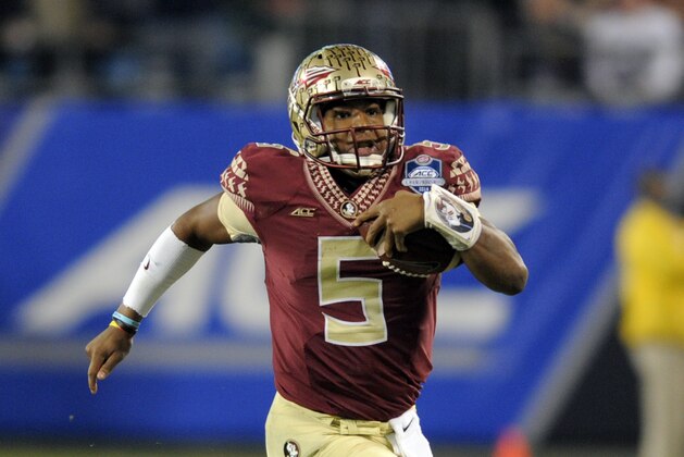 Florida State quarterback Jameis Winston (5) scrambles for a long gain against Georgia Tech during the first half of the Atlantic Coast Conference championship NCAA college football game in Charlotte, N.C., Saturday, Dec. 6, 2014. (AP Photo/Mike McCarn)