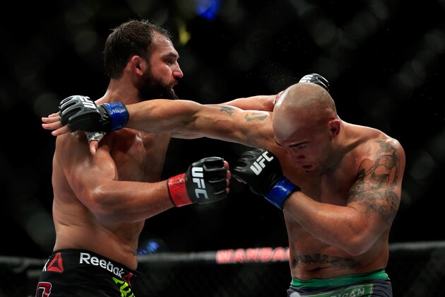 LAS VEGAS, NV - DECEMBER 06:  Robbie Lawler punches Johny Hendricks in their welterweight title fight during the UFC 181 event at the Mandalay Bay Events Center on December 6, 2014 in Las Vegas, Nevada.  (Photo by Alex Trautwig/Getty Images)