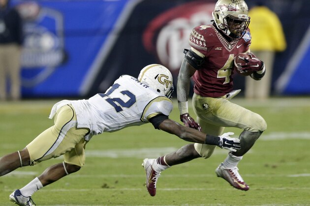 Florida State's Dalvin Cook (4) runs past Georgia Tech defensive back Demond Smith (12) during the second half of the Atlantic Coast Conference championship NCAA college football game in Charlotte, N.C., Saturday, Dec. 6, 2014. (AP Photo/Chuck Burton)