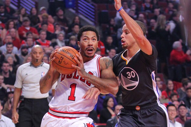 Dec 6, 2014; Chicago, IL, USA; Chicago Bulls guard Derrick Rose (1) drives past Golden State Warriors guard Stephen Curry (30) during the first quarter at the United Center. Mandatory Credit: Dennis Wierzbicki-USA TODAY Sports