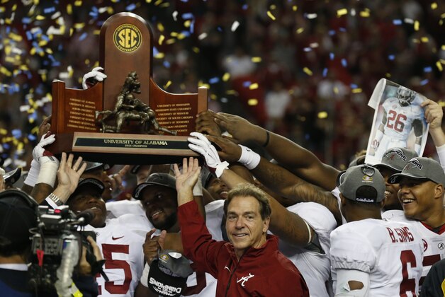 Alabama head coach Nick Saban and players celebrate after the second half of the Southeastern Conference championship NCAA college football game against Missouri, Saturday, Dec. 6, 2014, in Atlanta. Alabama won 42-13. (AP Photo/Brynn Anderson)
