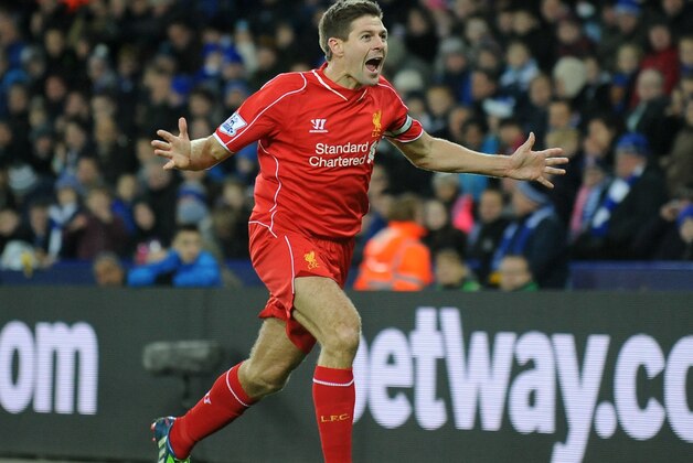 Liverpool's Steven Gerrard celebrates after scoring against Leicester during the English Premier League soccer match between Leicester City and Liverpool at King Power Stadium, in Leicester, England, Tuesday, Dec. 2, 2014.  (AP Photo/Rui Vieira)