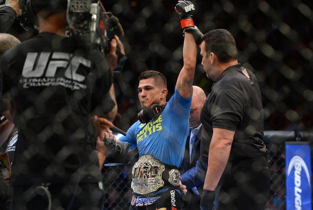 Dec 6, 2014; Las Vegas, NV, USA; Anthony Pettis (red) defeats Gilbert Melendez (blue) during UFC 181 at Madalay Bay Events Center. Pettis won via second round submission. Mandatory Credit: Joe Camporeale-USA TODAY Sports