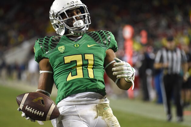 SANTA CLARA, CA - DECEMBER 05:  Kenny Bassett #31 of the Oregon Ducks celebrates a late game touchdown with  during the PAC-12 Championships against the Arizona Wildcatsat Levi's Stadium on December 5, 2014 in Santa Clara, California.  (Photo by Thearon W. Henderson/Getty Images)