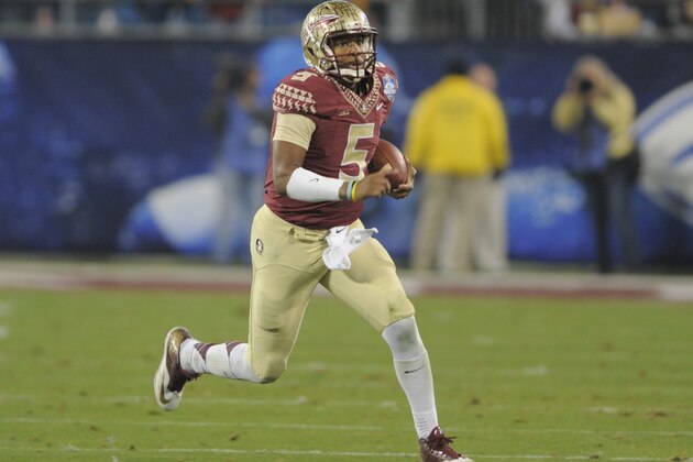 Florida State quarterback Jameis Winston (5) scrambles for a long gain against Georgia Tech during the first half of the Atlantic Coast Conference championship NCAA college football game in Charlotte, N.C., Saturday, Dec. 6, 2014. (AP Photo/Mike McCarn)