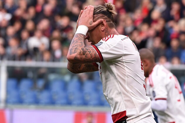 GENOA, ITALY - DECEMBER 07:  Philippe Mexes of Milan show his dejection during the Serie A match between Genoa CFC and AC Milan at Stadio Luigi Ferraris on December 7, 2014 in Genoa, Italy.  (Photo by Tullio M. Puglia/Getty Images)