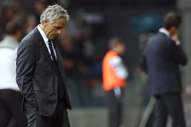 Parma's coach Roberto Donadoni looks down during the Serie A soccer match between Udinese and Parma at the Friuli Stadium in Udine, Italy, Monday Sept. 29, 2014. Udinese won 4-2. (AP Photo/Paolo Giovannini)