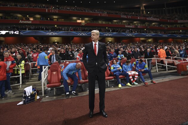 Arsenal's coach Arsene Wenger looks on during the Champions League Group D soccer match between Arsenal  and Galatasaray , at the Emirates Stadium in London, on Wednesday, Oct 1, 2014. (AP Photo/ Tim Ireland)