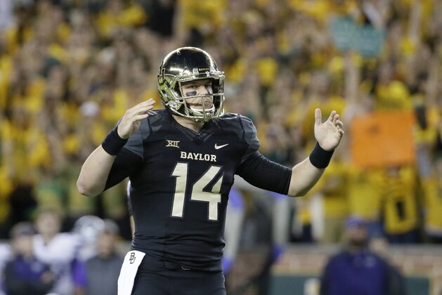 Baylor quarterback Bryce Petty (14) signals touchdown after running back Johnny Jefferson (2) scored on a running play in the first half of an NCAA college football game against Kansas State, Saturday, Dec. 6, 2014, in Waco, Texas. (AP Photo/Tony Gutierrez)