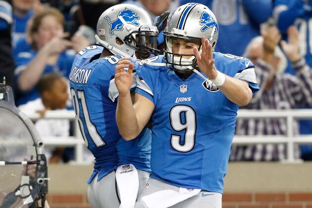DETROIT, MI - DECEMBER 7: Calvin Johnson #81 celebrates his first quarter touchdown with Matthew Stafford #9 of the Detroit Lions while playing the Tampa Bay Buccaneers at Ford Field on December 7, 2014 in Detroit, Michigan. (Photo by Leon Halip/Getty Images)