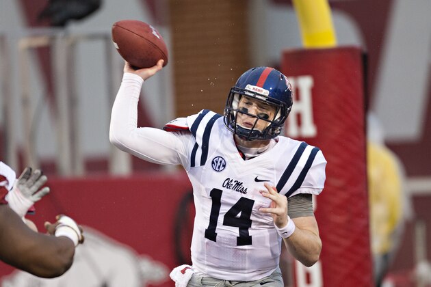 FAYETTEVILLE, AR - NOVEMBER 22:  Bo Wallace #14 of the Ole Miss Rebels throws a pass from the end zone during a game against the Arkansas Razorbacks in second quarter at Razorback Stadium on November 22, 2014 in Fayetteville, Arkansas.  (Photo by Wesley Hitt/Getty Images)