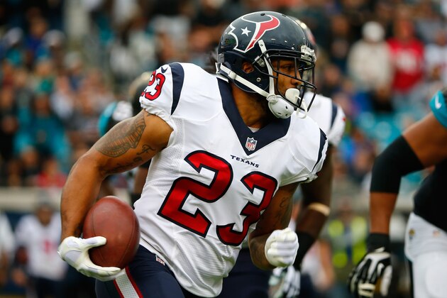 JACKSONVILLE, FL - DECEMBER 07:   Arian Foster #23 of the Houston Texans rushes for yardage during the game against the Jacksonville Jaguars at EverBank Field on December 7, 2014 in Jacksonville, Florida.  (Photo by Sam Greenwood/Getty Images)