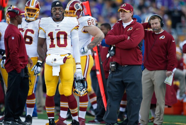 Nov 2, 2014; Minneapolis, MN, USA; Washington Redskins quarterback Robert Griffin III (10) and head coach Jay Gruden on the sidelines during a timeout in the game with the Minnesota Vikings at TCF Bank Stadium. The Vikings win 29-26. Mandatory Credit: Bruce Kluckhohn-USA TODAY Sports
