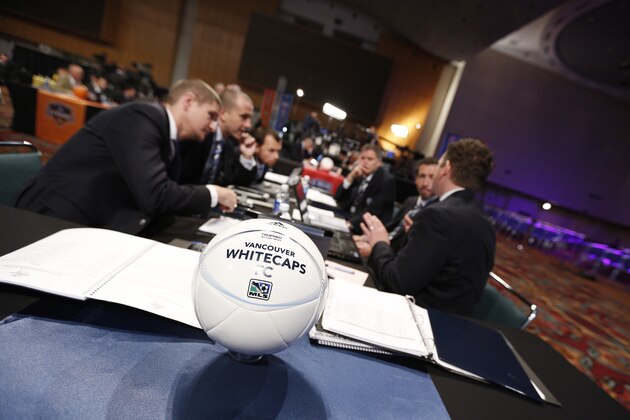 INDIANAPOLIS, IN - JANUARY 17: Vancouver Whitecaps FC officials discuss strategy prior to the 2013 MLS SuperDraft Presented by Adidas at the Indiana Convention Center on January 17, 2013 in Indianapolis, Indiana. (Photo by Joe Robbins/Getty Images)