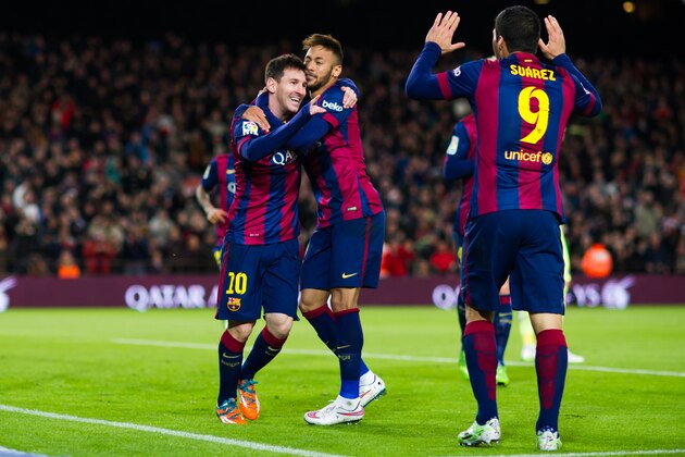BARCELONA, SPAIN - DECEMBER 07: Lionel Messi (L) of FC Barcelona celebrates with his teammates Neymar Santos Jr (C) and Luis Suarez (R) after scoring his second team's goal during the La Liga match between FC Barcelona and RCD Espanyol at Camp Nou on December 7, 2014 in Barcelona, Spain. (Photo by Alex Caparros/Getty Images)