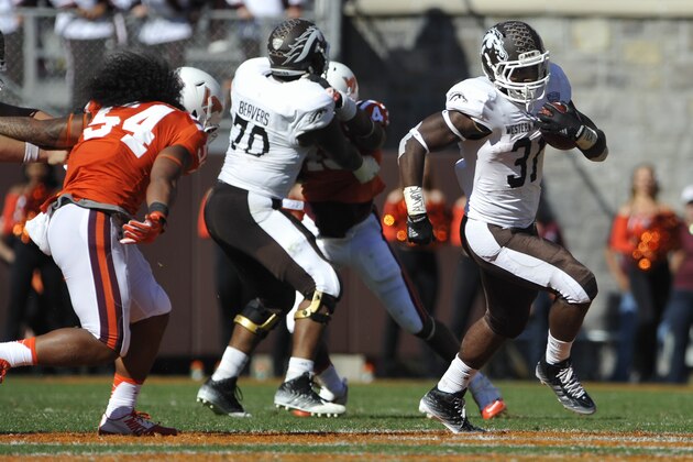 BLACKSBURG, VA - SEPTEMBER 27:  Running back Jarvion Franklin #31 of the Western Michigan Broncos rushes to the outside against Virginia Tech Hokies in the second half at Lane Stadium on September 27, 2014 in Blacksburg, Virginia. Virginia Tech defeated Western Michigan 35-17. (Photo by Michael Shroyer/Getty Images)