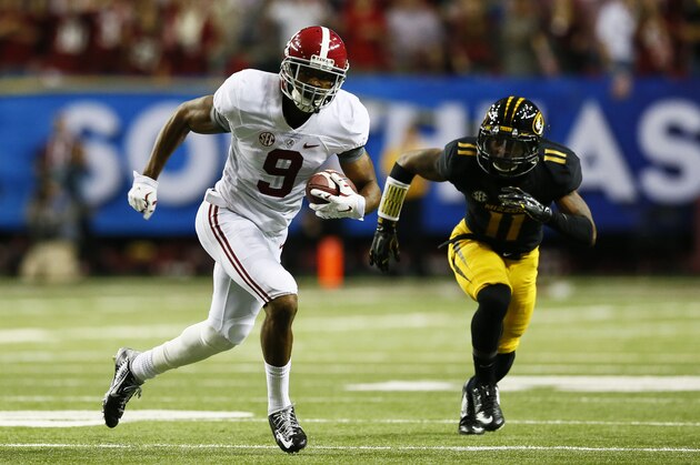ATLANTA, GA - DECEMBER 06:  Amari Cooper #9 of the Alabama Crimson Tide carries a reception against the defense of Aarion Penton #11 of the Missouri Tigers in the first quarter of the SEC Championship game at the Georgia Dome on December 6, 2014 in Atlanta, Georgia.  (Photo by Kevin C. Cox/Getty Images)