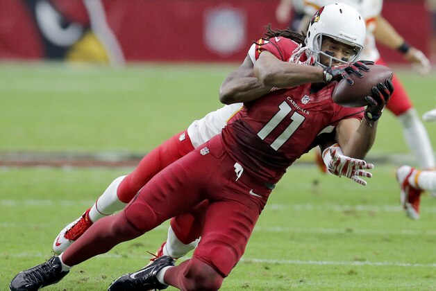Arizona Cardinals wide receiver Larry Fitzgerald (11) makes a catch against the Kansas City Chiefs during the first half of an NFL football game, Sunday, Dec. 7, 2014, in Glendale, Ariz. (AP Photo/Rick Scuteri)
