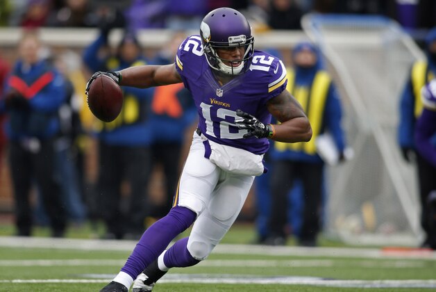 Dec 7, 2014; Minneapolis, MN, USA; Minnesota Vikings wide receiver Charles Johnson (12) catches a pass against the New York Jets but fumbles it at the goal line before the Vikings recover it for a touchdown in the second quarter at TCF Bank Stadium. Mandatory Credit: Bruce Kluckhohn-USA TODAY Sports