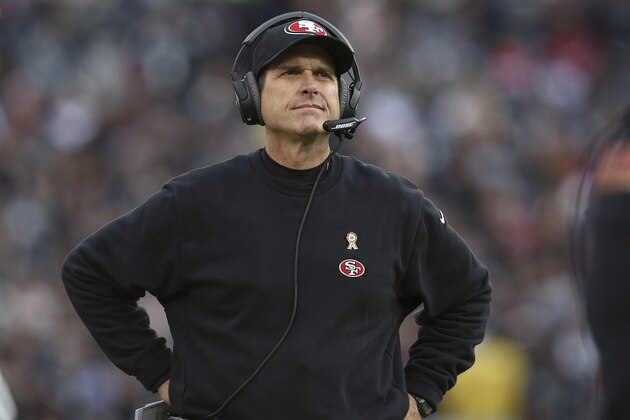 San Francisco 49ers head coach Jim Harbaugh stands on the sideline during the second half of an NFL football game against the Oakland Raiders in Oakland, Calif., Sunday, Dec. 7, 2014. The Raiders won 24-13. (AP Photo/Ryan Kang)