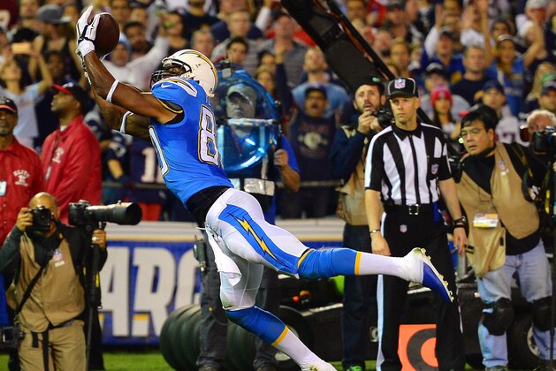 Dec 7, 2014; San Diego, CA, USA; San Diego Chargers wide receiver Malcom Floyd (80) catches a touchdown pass as New England Patriots cornerback Brandon Browner (39) defends during the second quarter at Qualcomm Stadium. Mandatory Credit: Jake Roth-USA TODAY Sports