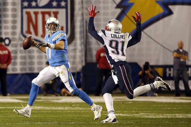 San Diego Chargers quarterback Philip Rivers looks to throw under pressure by New England Patriots outside linebacker Jamie Collins during the first half in an NFL football game Sunday, Dec. 7, 2014, in San Diego. (AP Photo/Lenny Ignelzi)