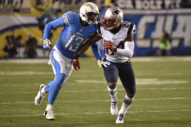 San Diego Chargers wide receiver Keenan Allen, left, and New England Patriots cornerback Darrelle Revis bump during the first half in an NFL football game Sunday, Dec. 7, 2014, in San Diego. (AP Photo/Denis Poroy)