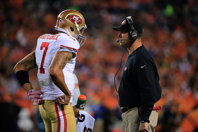 DENVER, CO - OCTOBER 19: Head coach Jim Harbaugh of the San Francisco 49ers has a word with Colin Kaepernick #7 during a game against the Denver Broncos at Sports Authority Field at Mile High on October 19, 2014 in Denver, Colorado. (Photo by Doug Pensinger/Getty Images)
