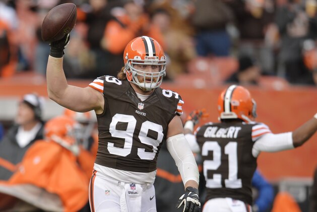 Cleveland Browns outside linebacker Paul Kruger (99) celebrates after a fumble recovery against the Indianapolis Colts in the third quarter of an NFL football game Sunday, Dec. 7, 2014, in Cleveland. (AP Photo/David Richard)