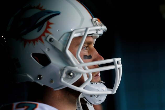 MIAMI GARDENS, FL - DECEMBER 07: Quarterback Ryan Tannehill #17 of the Miami Dolphins pauses before running onto the field before the Dolphins met the Baltimore Ravens in a game at Sun Life Stadium on December 7, 2014 in Miami Gardens, Florida.  (Photo by Chris Trotman/Getty Images)