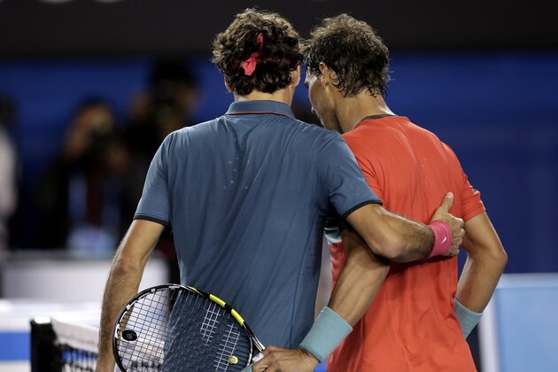 Rafael Nadal of Spain, right, is congratulated by Roger Federer of  Switzerland at the net after Nadal won their semifinal at the Australian Open tennis championship in Melbourne, Australia, Friday, Jan. 24, 2014.(AP Photo/Rick Rycroft)