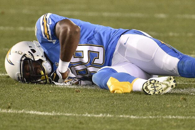 San Diego Chargers tight end Ladarius Green stays down on the field after he is hit by New England Patriots cornerback Brandon Browner during the second half in an NFL football game Sunday, Dec. 7, 2014, in San Diego. (AP Photo/Denis Poroy)