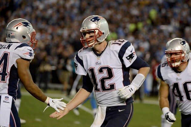 SAN DIEGO, CA-  DECEMBER 7:  Tom Brady #12 of the New England Patriots celebrates his fourth-quarter touchdown pass to Julian Edelman (not pictured) during an NFL game at Qualcomm Stadium on December 7, 2014 in San Diego, California. (Photo by Donald Miralle/Getty Images)