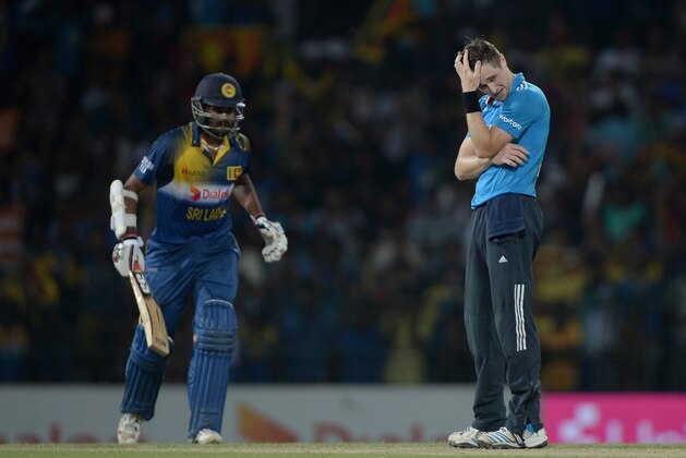 COLOMBO, SRI LANKA - DECEMBER 07:  Chris Woakes of England holds his head after bowling during the 4th One Day International match between Sri Lanka and England at R. Premadasa Stadium on December 7, 2014 in Colombo, Sri Lanka.  (Photo by Gareth Copley/Getty Images)