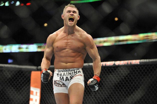Jan 25, 2014; Chicago, IL, USA; Daron Cruickshank (red gloves) reacts after beating Mike Rio (not pictured) during UFC on FOX 10 at the United Center. Mandatory Credit: David Banks-USA TODAY Sports