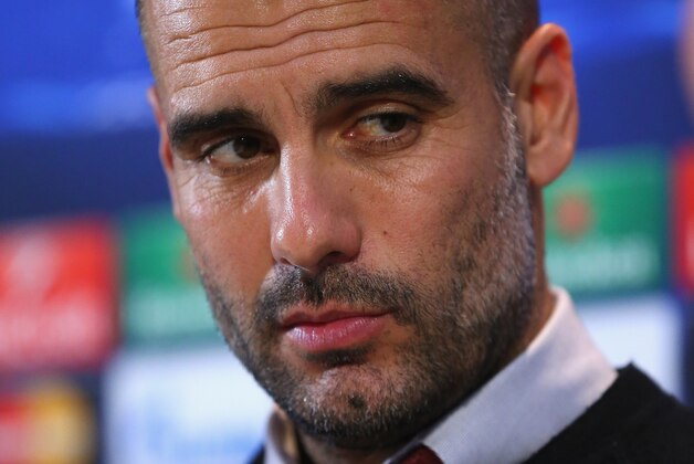 MANCHESTER, ENGLAND - NOVEMBER 24:  Pep Guardiola the coach of FC Bayern Muenchen faces the media during a press conference at the Lowry Hotel on November 24, 2014 in Manchester, United Kingdom.  (Photo by Alex Livesey/Getty Images)